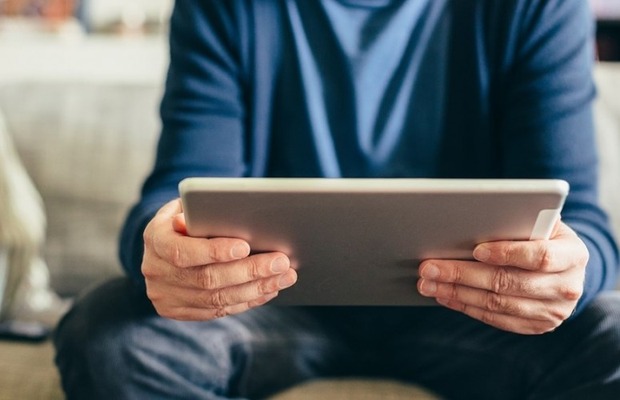 Man holding an iPad