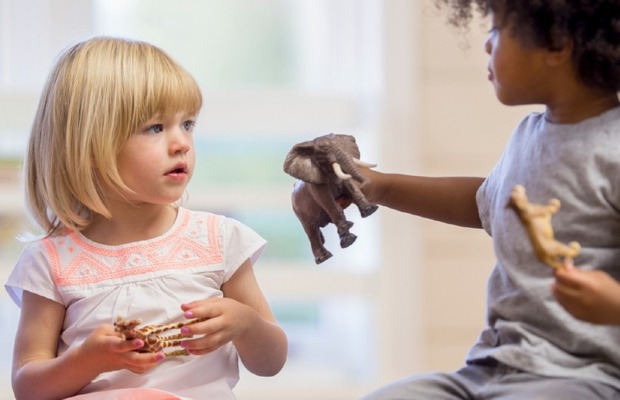 Image of two children interacting.