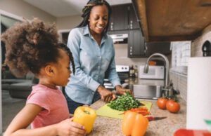 Mother and daughter cooking together