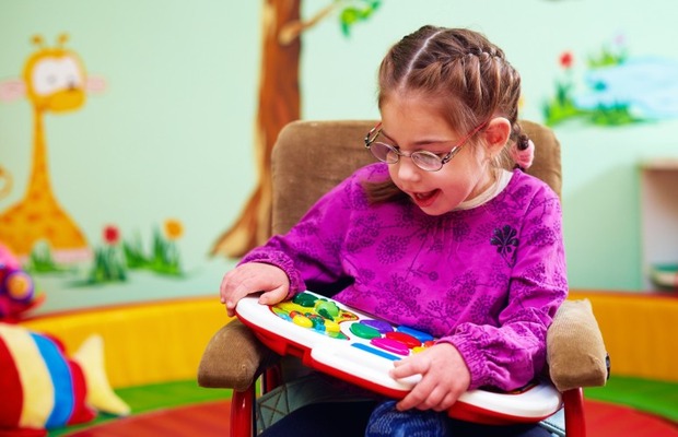 Girl engaged with learning tool.