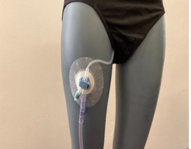 An example of correct catheter placement on a mannequin