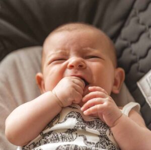 Baby with finger in the mouth