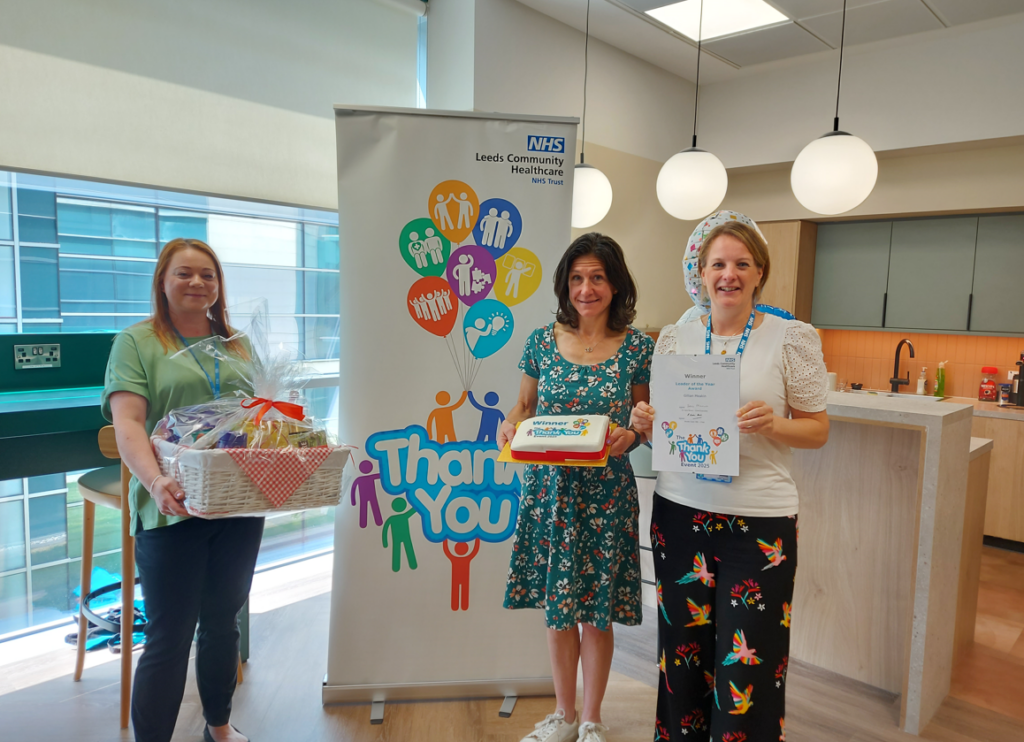 LCH Executive Medical Director Ruth Burnett presents the Leader of the Year Winner Gillian Meakin her award, hamper and cake.