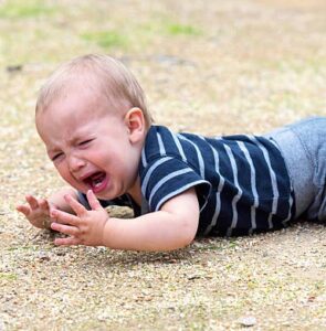 toddler on the floor crying