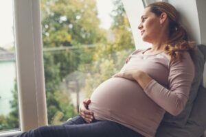 a pregnant woman sat on the chair