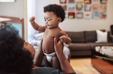 mother carrying baby