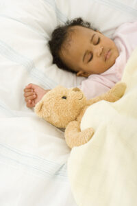 baby asleep with teddy