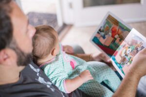Dad and baby reading