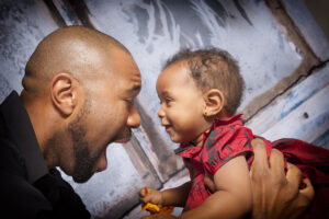 father and daughter smiling at each other