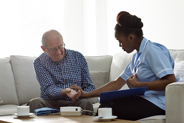 Clinician visiting a patient at home
