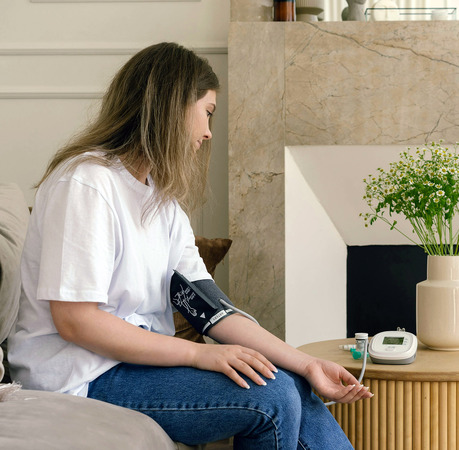 a woman checking her blood pressure