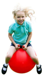 Girl on a red space hopper